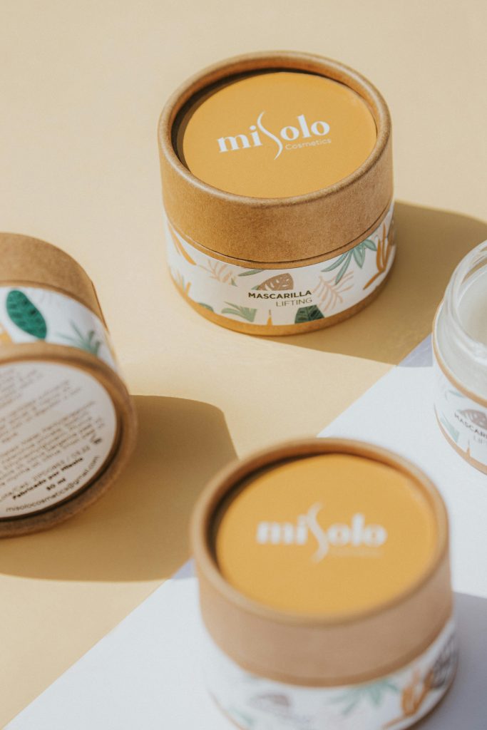 Eco-friendly skincare products with sustainable packaging on a minimalist background.